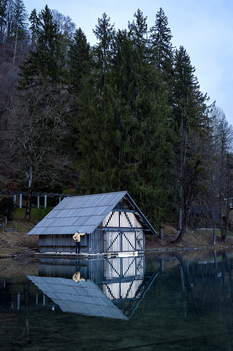 OFIS architects renovates boathouse in slovenia with rooftop garden that filters lake water