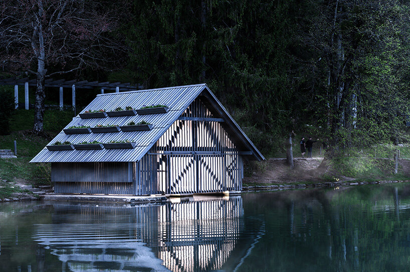OFIS architects renovates boathouse in slovenia with rooftop garden that filters lake water