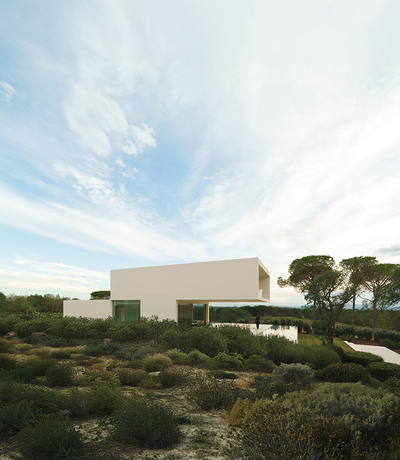 fran silvestre arquitectos stretches all-white linear residence across narrow site in spain