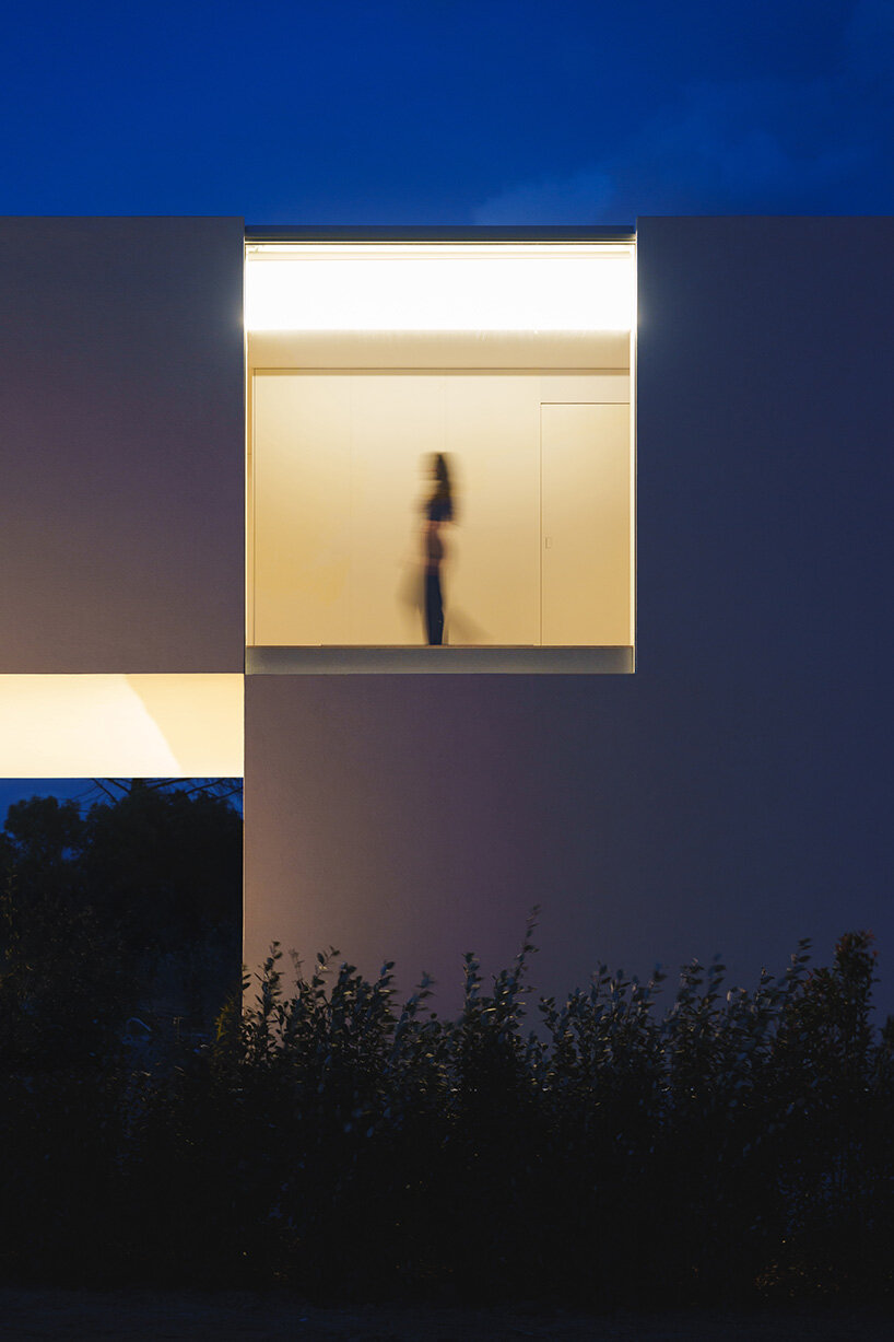 fran silvestre arquitectos stretches all-white linear residence across narrow site in spain