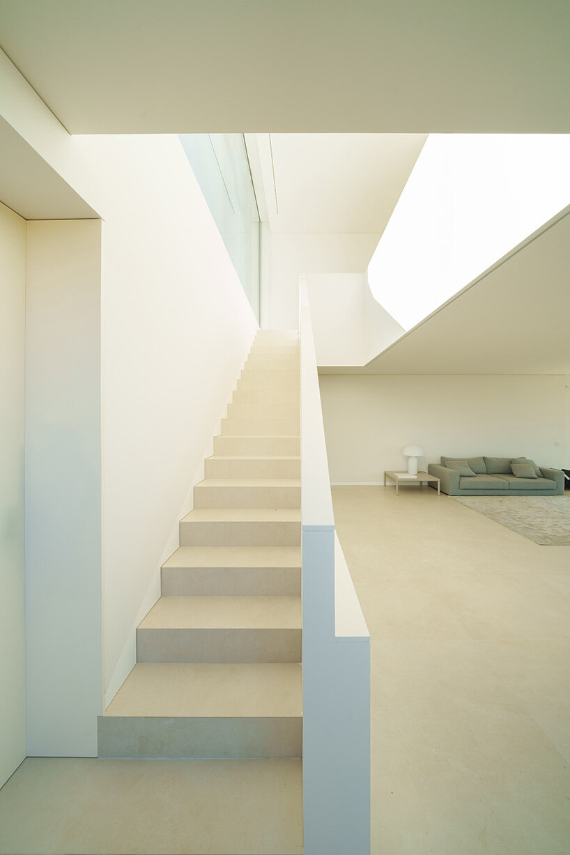 fran silvestre arquitectos stretches all-white linear residence across narrow site in spain