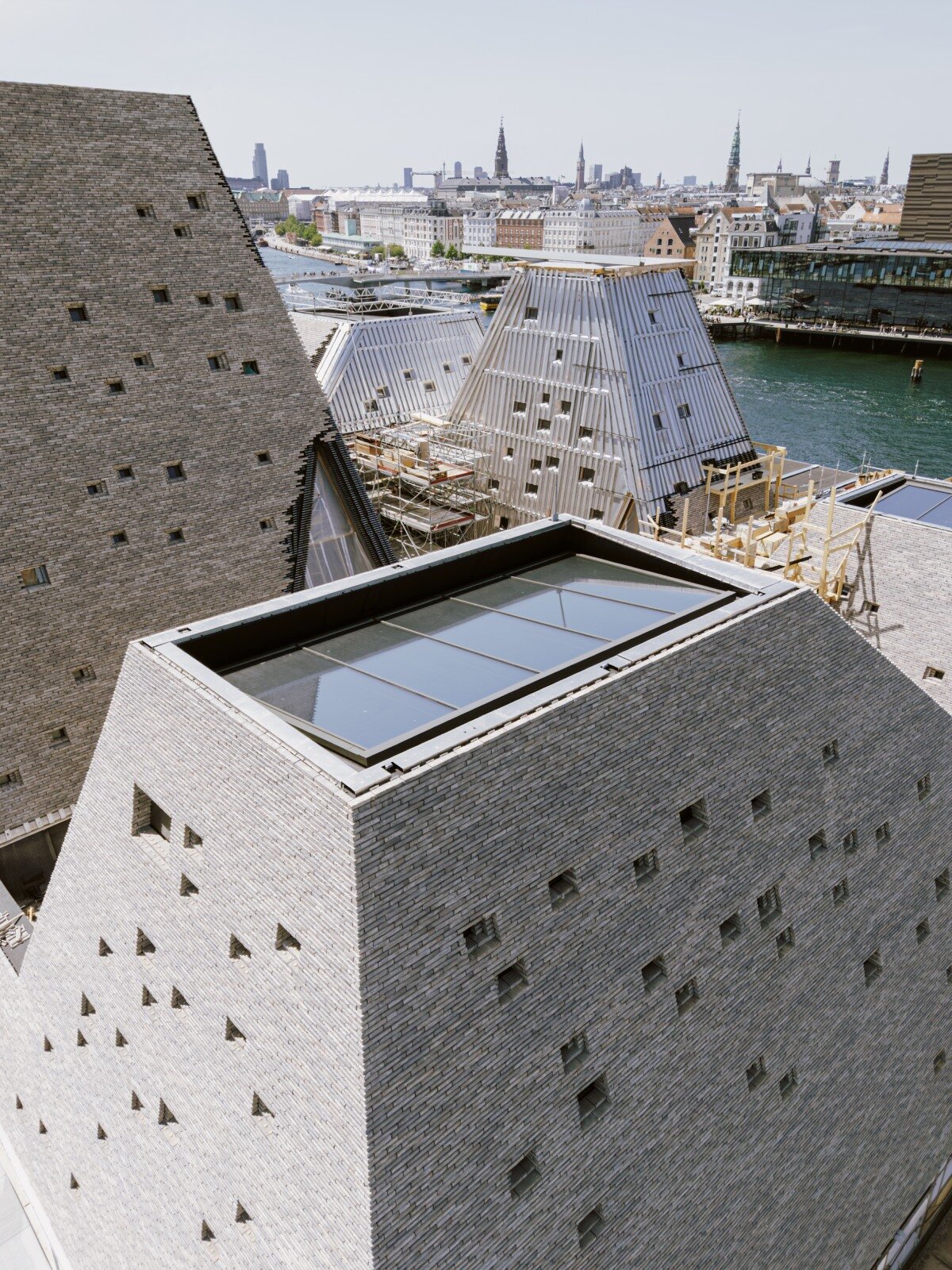 francisco tirado captures progress on kengo kuma's pyramidal culture center in copenhagen