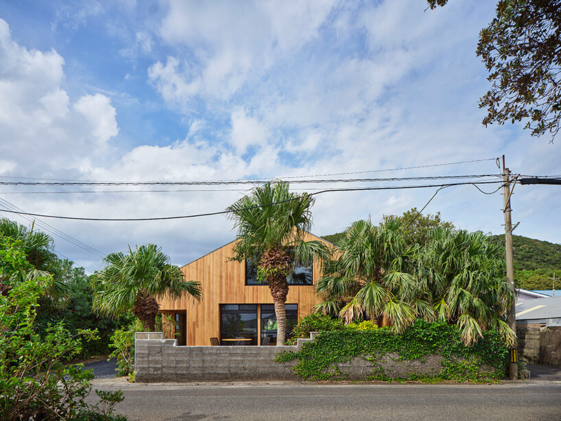 furuya design reworks japanese island bungalow into nature-immersed SANU home