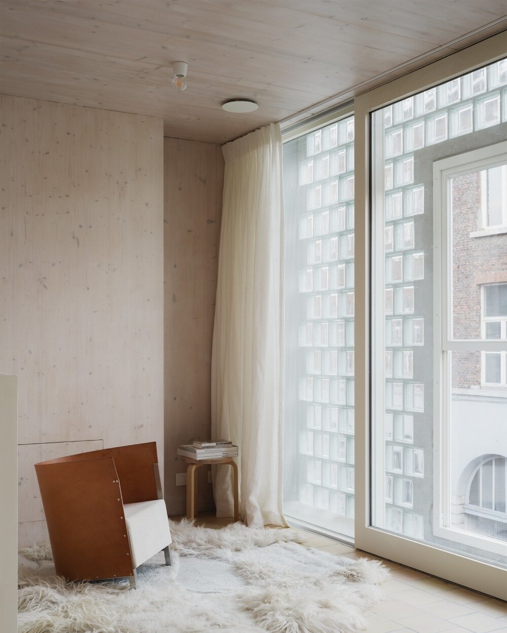 delmulle delmulle's gradient brick facade shifts from terracotta to glass in amsterdam townhouse