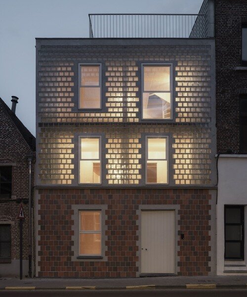 delmulle delmulle's gradient brick facade shifts from terracotta to glass in belgium house