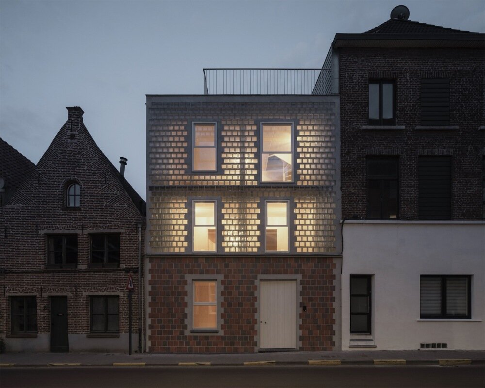 delmulle delmulle's gradient brick facade shifts from terracotta to glass in amsterdam townhouse