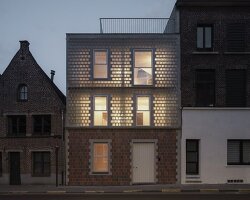 delmulle delmulle's gradient brick facade shifts from terracotta to glass in amsterdam house