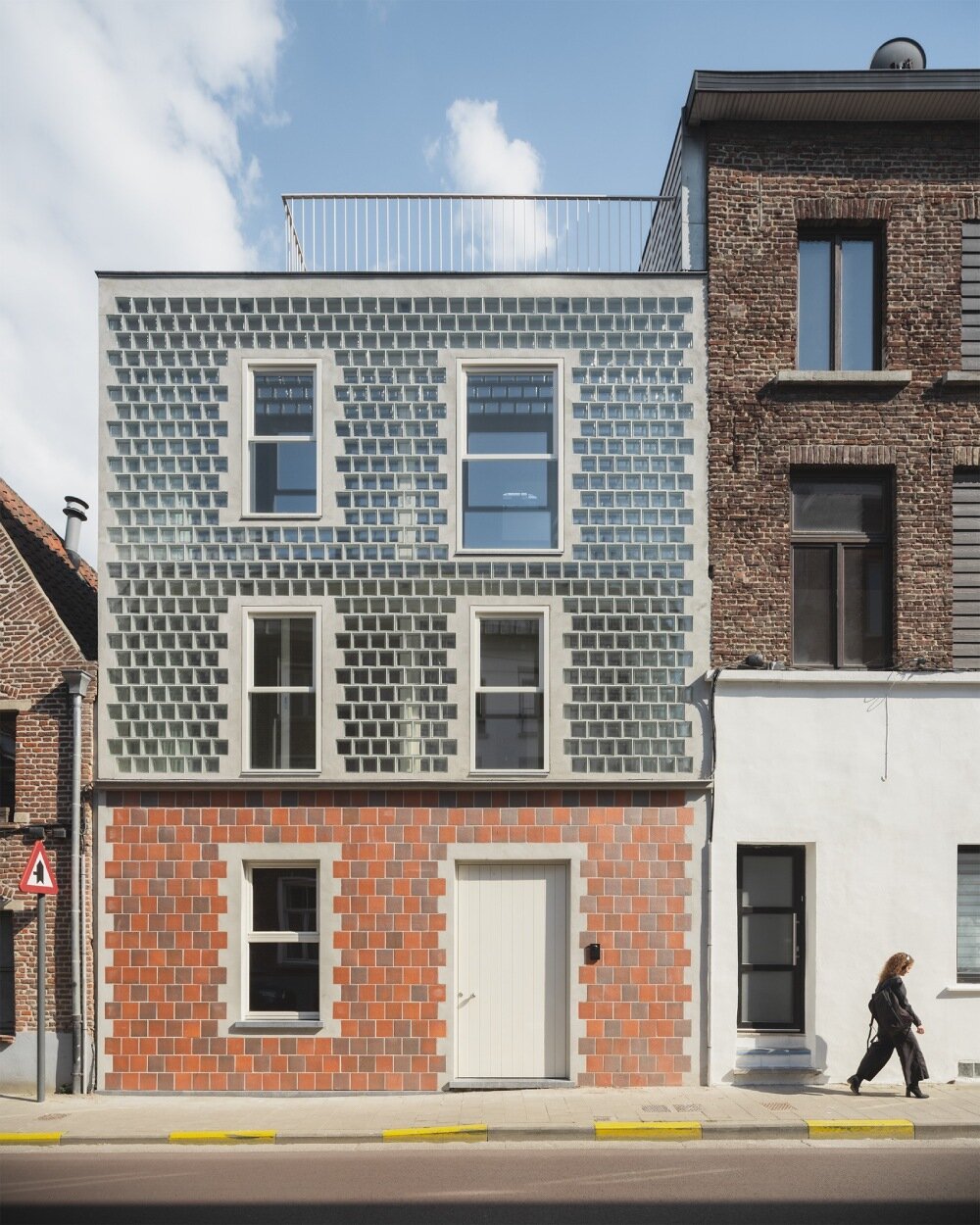 delmulle delmulle's gradient brick facade shifts from terracotta to glass in amsterdam townhouse