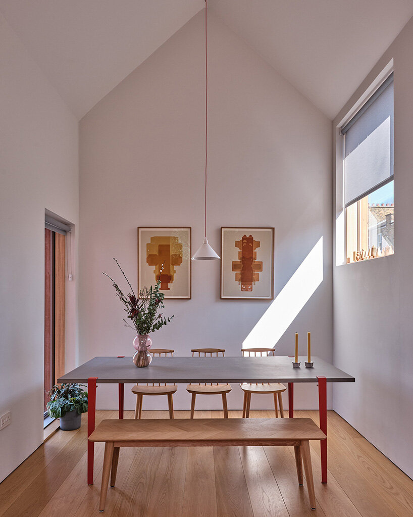 monochromatic facade wraps graeme williamson's dual-gabled 'twin house' in london