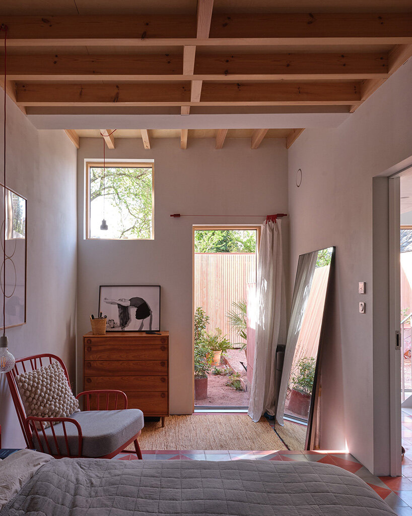 monochromatic facade wraps graeme williamson's dual-gabled 'twin house' in london