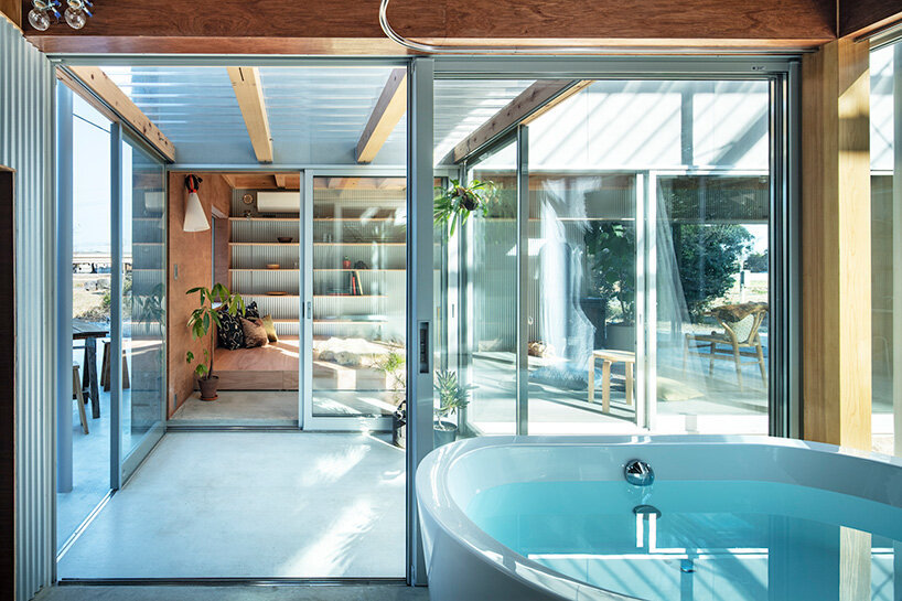 interlinked garden rooms stretch beneath single roof in tamada & wakimoto's japanese house