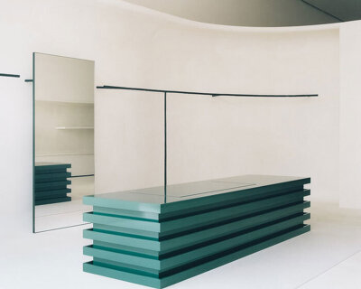 jil sander hamburg store's sculptural display elements shape hybrid boutique interiors