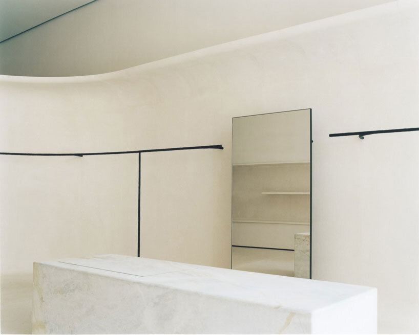 jil sander hamburg store's sculptural display elements shape hybrid boutique interiors