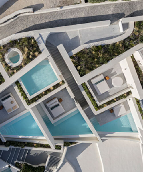 shaped like cubic prisms, kapsimalis architects' hotel rooms echo cave houses in santorini