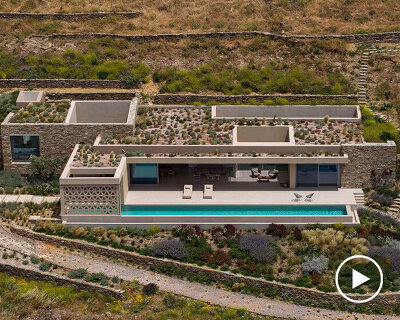 katerina valsamaki embeds subterranean house into hillside slot on tinos island, greece