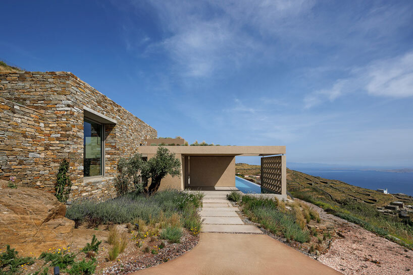 katerina valsamaki embeds subterranean house into hillside slot on tinos island, greece