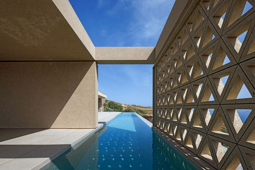 katerina valsamaki embeds subterranean house into hillside slot on tinos island, greece