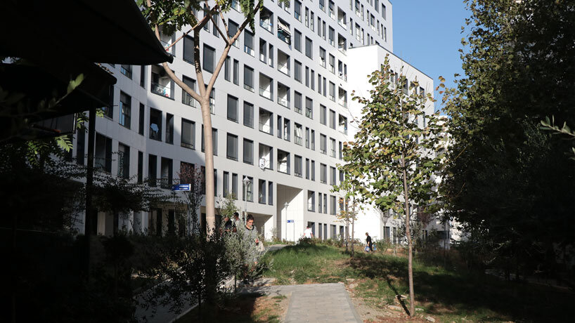 studio libeskind & kontakt weave public gardens through curved residences in tirana