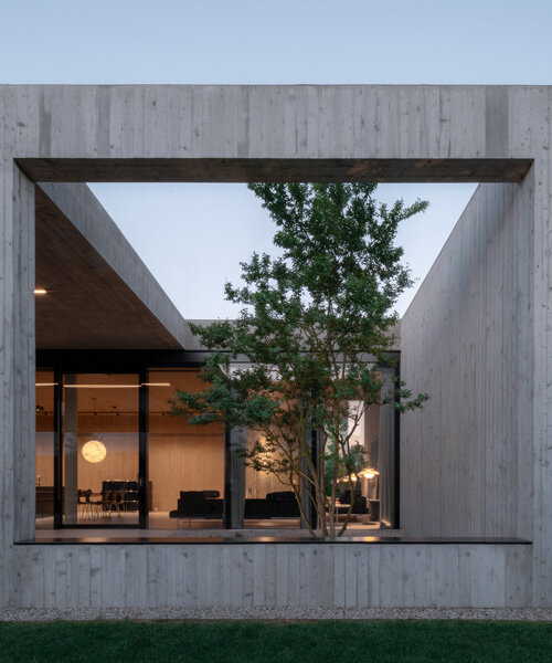 house by MIDE architetti integrates interior and landscape on the outskirts of padua