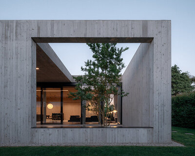house by MIDE architetti integrates interior and landscape on the outskirts of padua