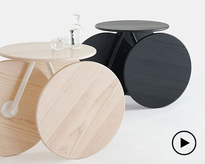 four identical wooden circles sculpt rolling table by mike & maaike