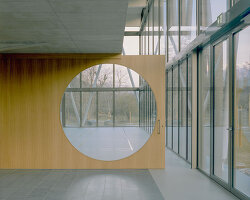 lattice of beams enfolds multipurpose gymnasium's facade in switzerland by demattè fontana