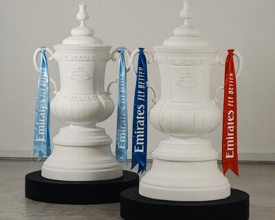 fans' inscriptions cover nigel VMU's six-foot sculptural cup trophy replicas for FA cup final