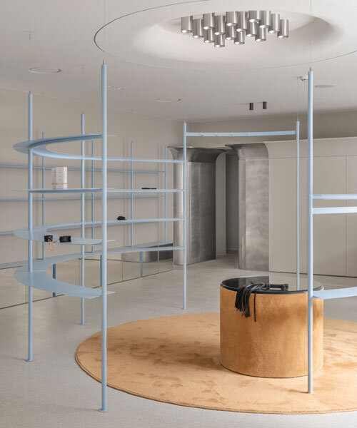 circular shelving units outline njoy sex shop's minimal interior in kyiv