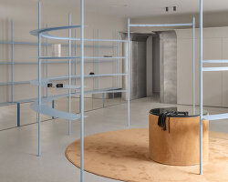 circular shelving units outline njoy sex shop's minimal interior in kyiv
