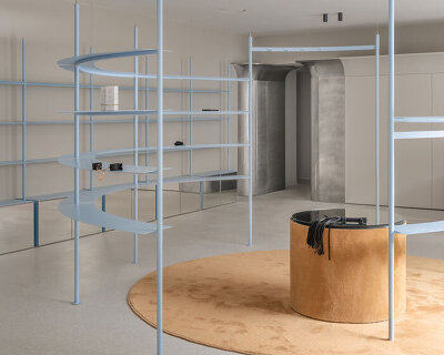circular shelving units outline njoy sex shop's minimal interior in kyiv