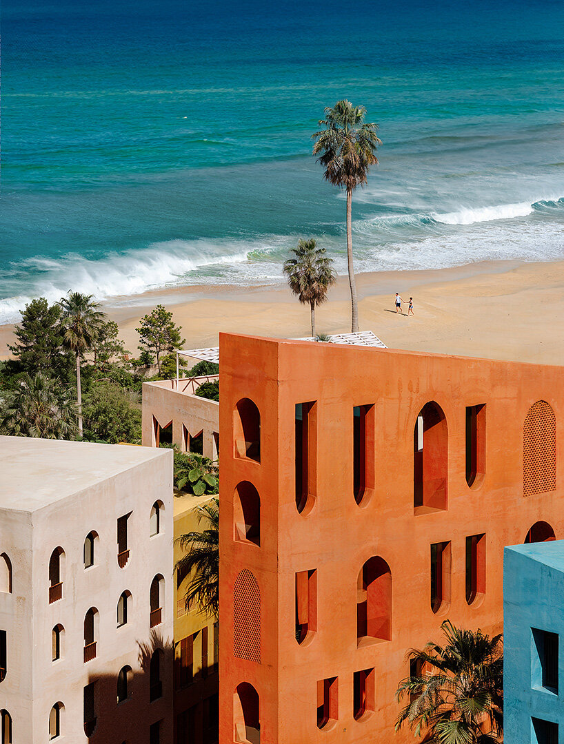 oppenheim architecture layers village-scale blocks and vibrant towers on albania's coast