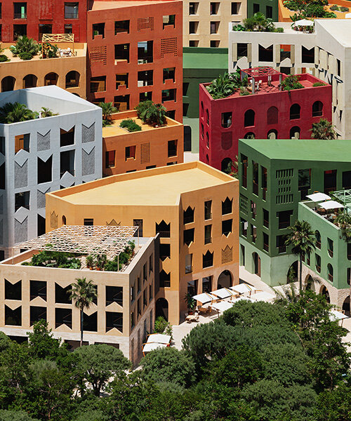 oppenheim architecture layers village-scale blocks and vibrant towers on albania's coast