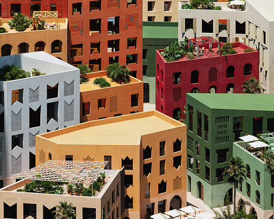 oppenheim architecture layers village-scale blocks and vibrant towers on albania's coast