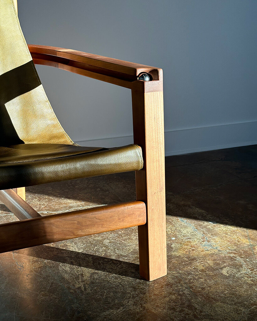 steel ball set into armrest of tanuvi hegde's 'reflect' chair for fidget-friendly design