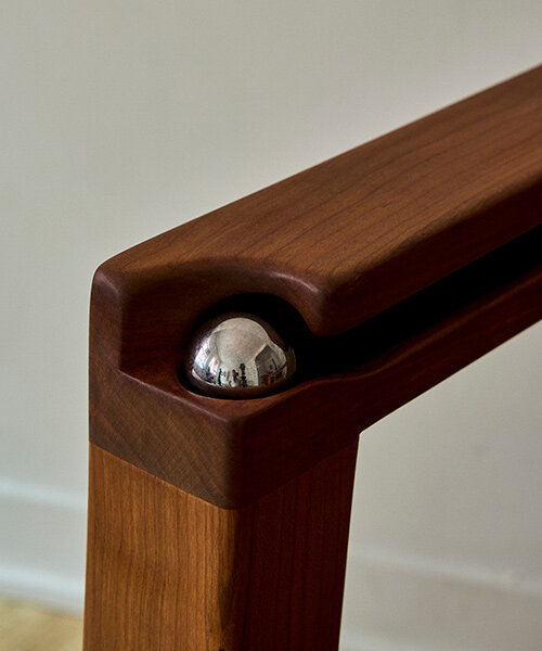 steel ball set into armrest of tanuvi hegde's 'reflect' chair for fidget-friendly design