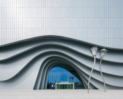 sinuous steel ribs flow around unsangdong architects' art museum in korea