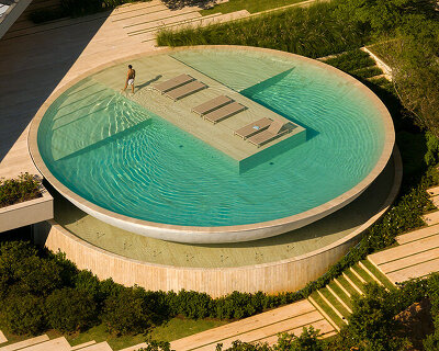 passarelli arquitetos perches swimming pool like a monumental bowl beside casa da baro