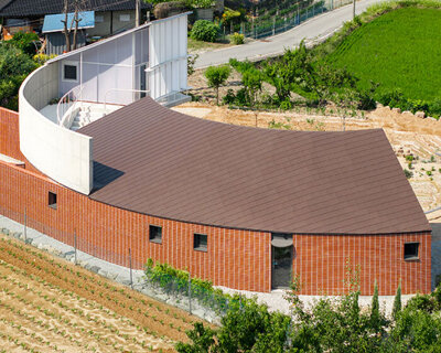 circular house by sukchulmok + BRBB encloses vegetable garden on korean farmland