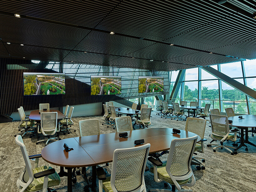 folded glass facade fronts AWSOM medical school's new arkansas building