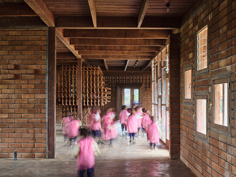 rammed earth and local wood shape community-first kindergarten in cameroon by urbanitree
