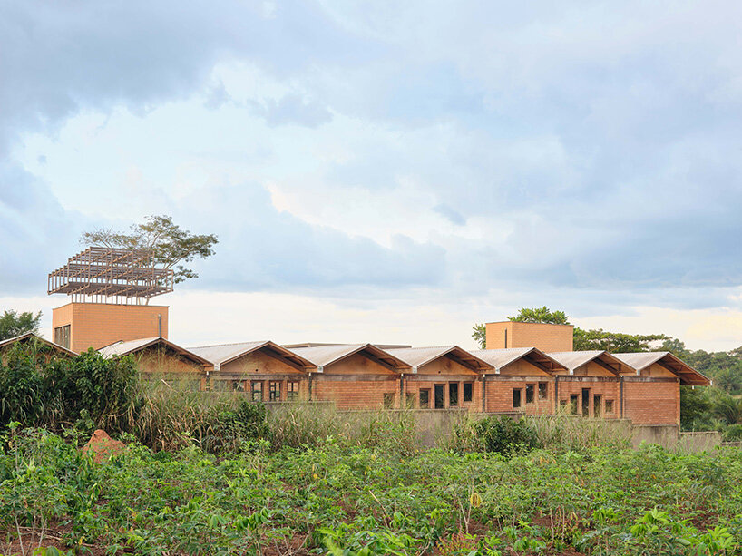 rammed earth and local wood shape community-first kindergarten in cameroon by urbanitree