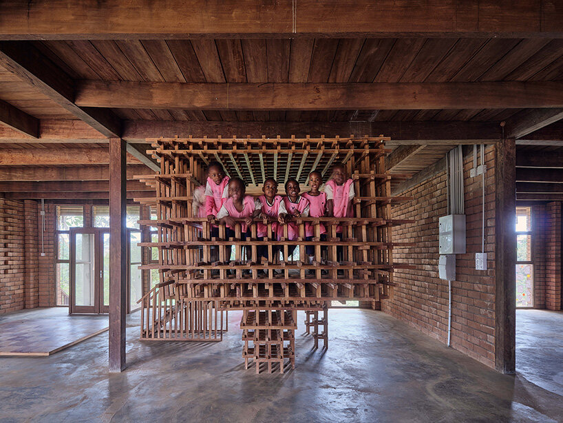 rammed earth and local wood shape community-first kindergarten in cameroon by urbanitree