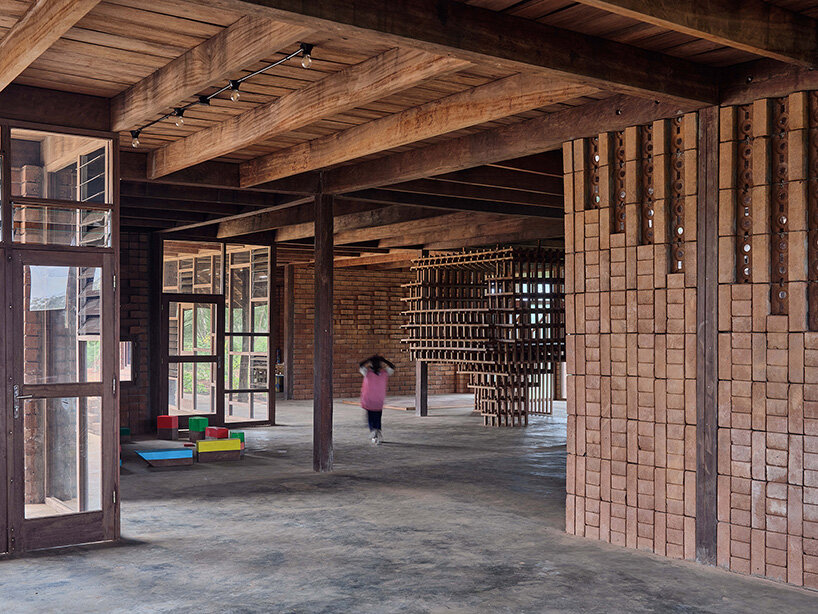 rammed earth and local wood shape community-first kindergarten in cameroon by urbanitree