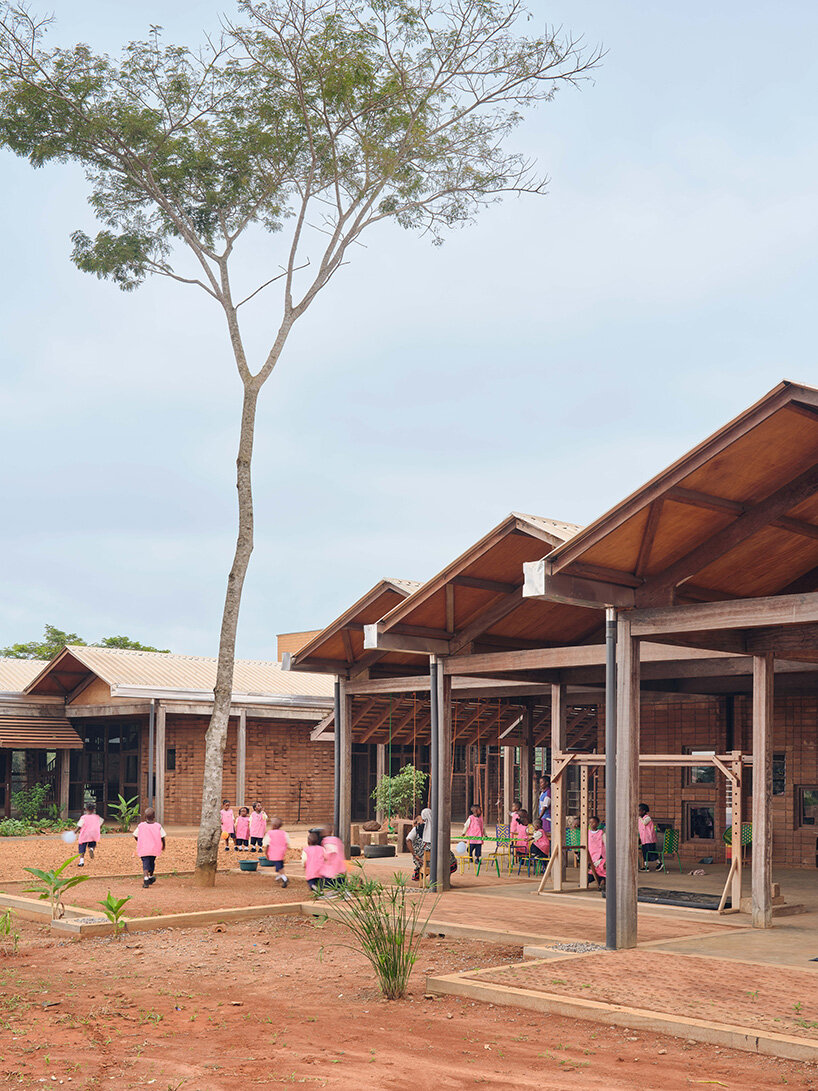 rammed earth and local wood shape community-first kindergarten in cameroon by urbanitree