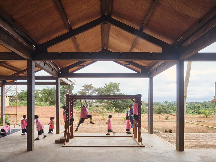 rammed earth and local wood shape community-first kindergarten in cameroon by urbanitree