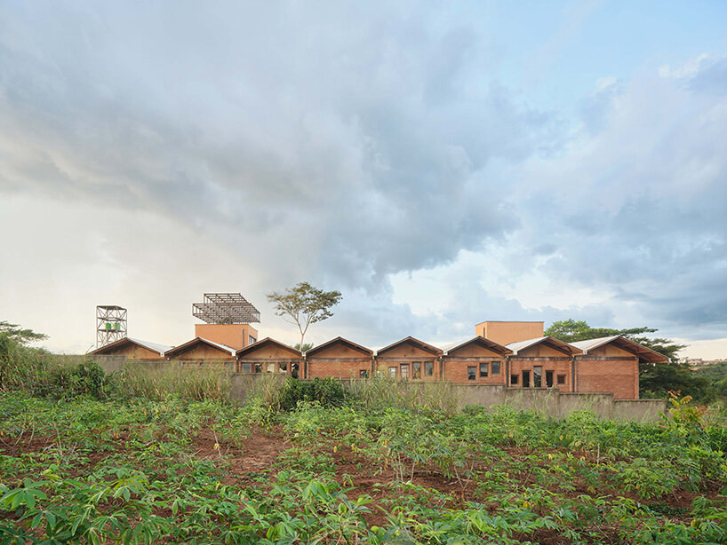 rammed earth and local wood shape community-first kindergarten in cameroon by urbanitree