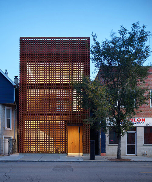 brick facade shrouds range-designed NDC furniture studio headquarters in chicago