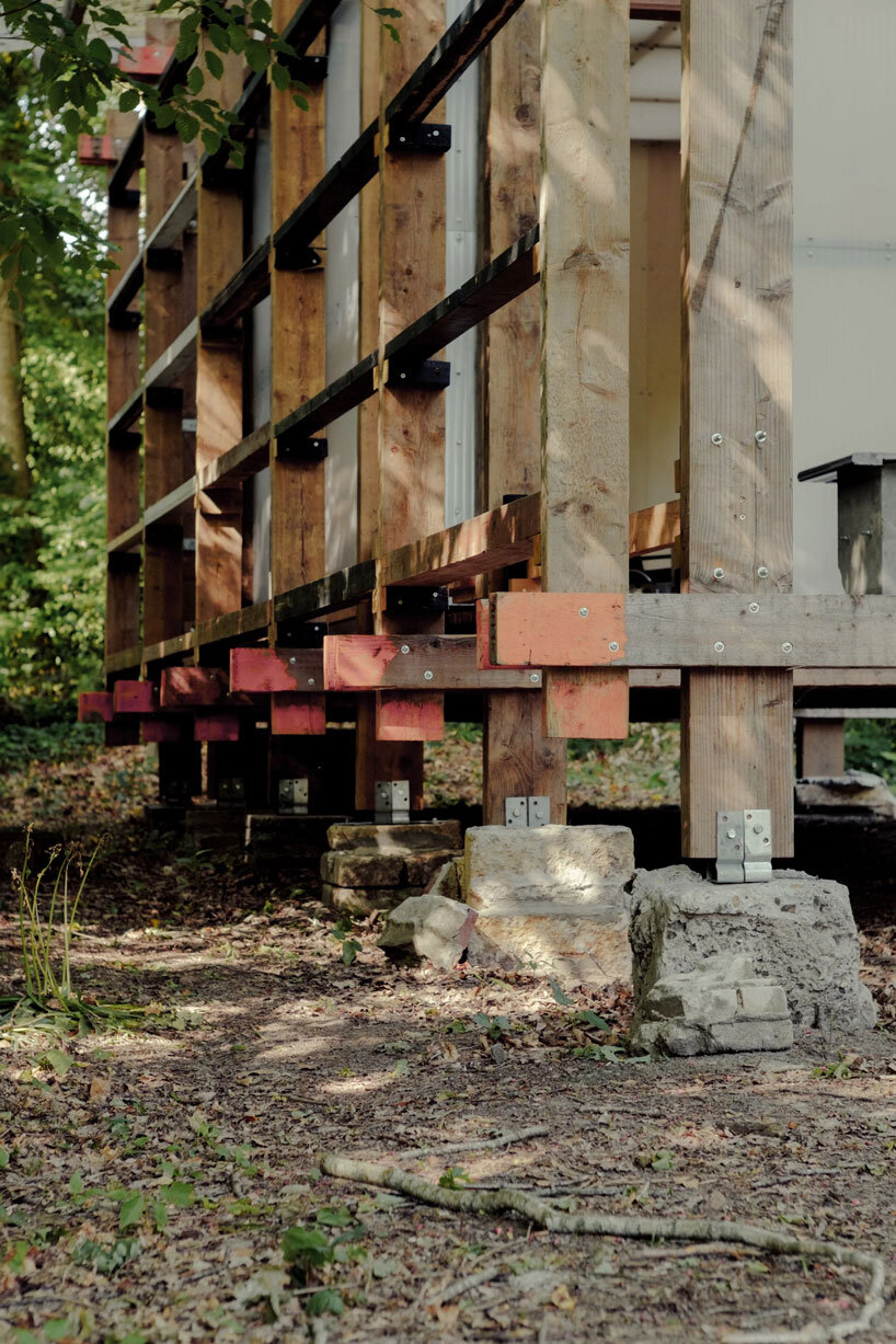salvaged materials compose studio-method's new hub for art and ecology in dutch forest