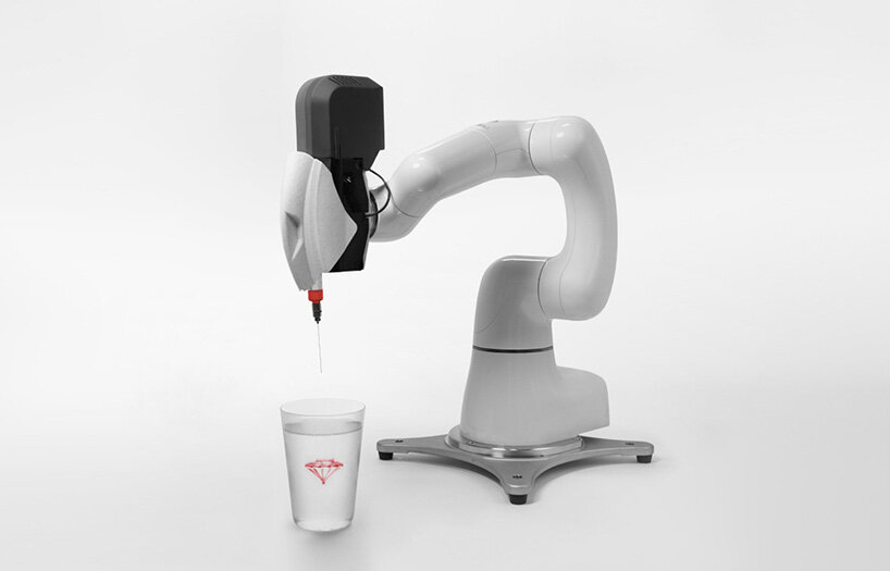 drawing robot allows users to sketch floating illustrations inside liquids