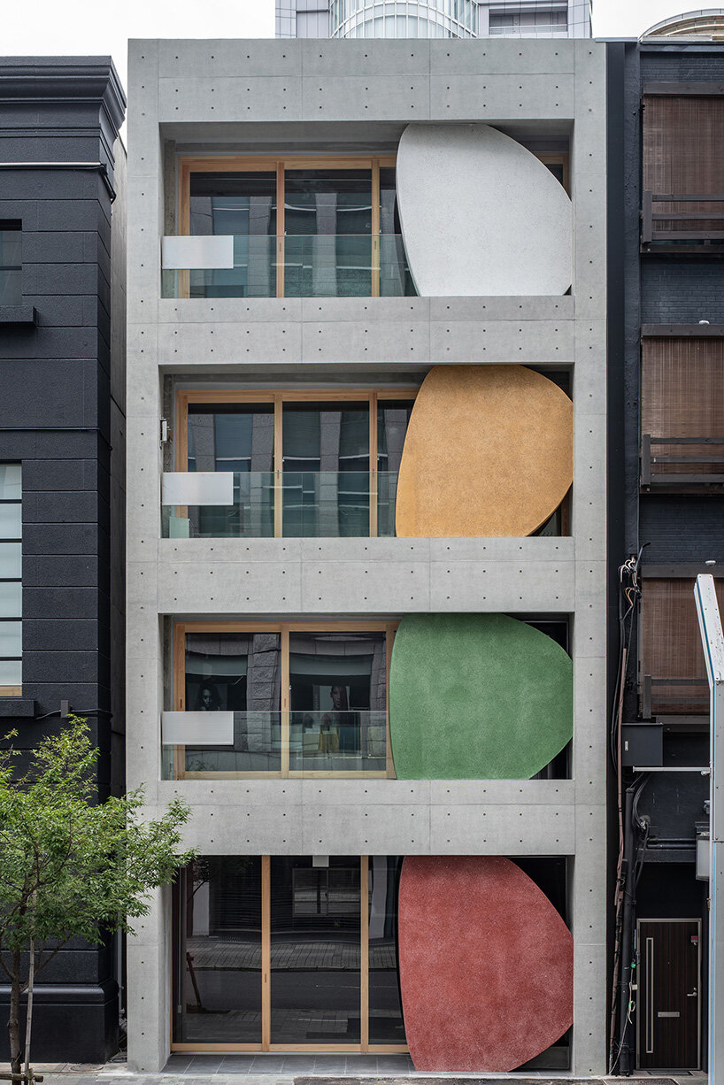 sculptural ovals shape seismic retrofit of 50-year-old building in japan by C+A